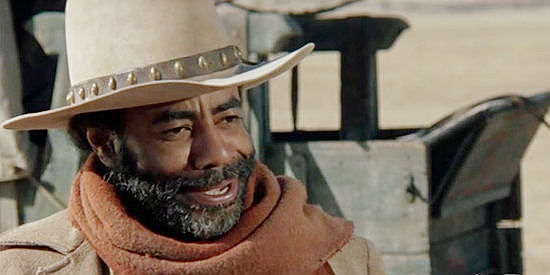 Rosceo Lee Browne as Jebediah Nightlinger, introducing himself as prospective cook on Will Anderson's cattle drive in The Cowboys (1972)
