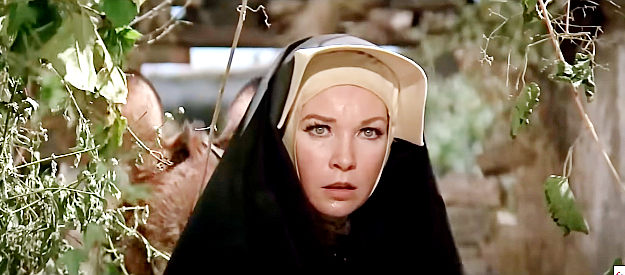 Shirley MacLaine as Sister Sara, finding her way through an abandoned mission in Two Mules for Sister Sara (1970)