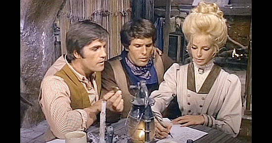 Sydne Rome as Scarlett, helping Ted (Nino Benvenuti) and Monty (Giuliano Gemma) write her ransom letter in Alive or Preferably Dead (1969)