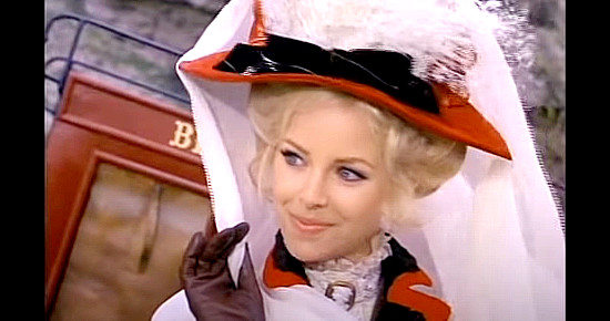 Sydne Rome as Scarlett, thrilled to be the victim of a stage holdup in Alive or Preferably Dead (1969)