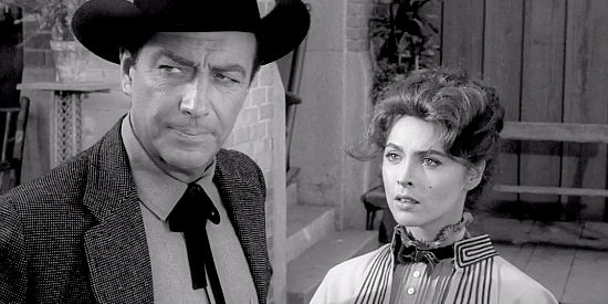 Tina Louise as Selah Jennison with Robert Taylor as Mackenzie Bovard as she faces a decision about her future in The Hangman (1959)