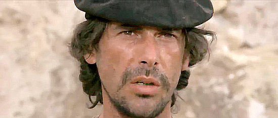 Tomas Milian as El Vasco, learning a lesson about a young woman's wrath in Companeros (1970)
