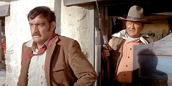Victor French as Ketcham under the gun of Cord McNally (John Wayne) in Rio Lobo (1970)
