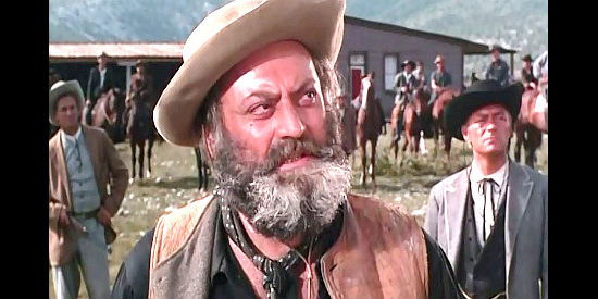 Vladimir Medar as Harley Whitmore, determined to take Red Grass Valley from the Dancer family in Massacre at Grand Canyon (1964)