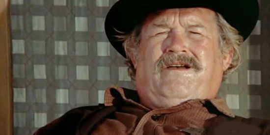 Walter Barnes as Sheriff Sam Shaw, watching the Stranger ride into Lago in High Plains Drifter (1973)