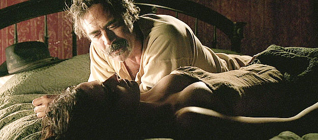 Jeffrey Dean Morgan as Henry Delarue, gloating over finally bedding his late brother's wife (Eva Green as Madelaine) in The Salvation (2014)