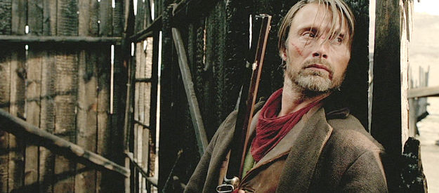 Mads Mikkelsen as Jon Jensen, ready to strike back at Henry Delarue and his henchmen in The Salvation (2014)