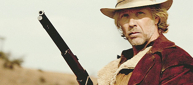 Mikael Persbrandt as Peter Jensen, sensing trouble at the homestead in The Salvation (2014)