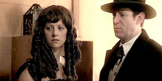 Saloon girl Sally (Candice Linstone) and Sheriff Jackson (Lawrence Evenchick) confronting some of Killian's men in Jesse James Lawman (2015)