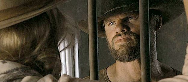 Evan Jones as Lewis, the outlaw who was supposed to watch over Anna but lands behind bars in A Million Ways to Die in the West (2014)