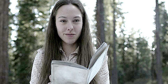 Jasmin Jandreau as Amelia, hopeful a frontier guide she's found will lead her to a town in The Trail (2013)