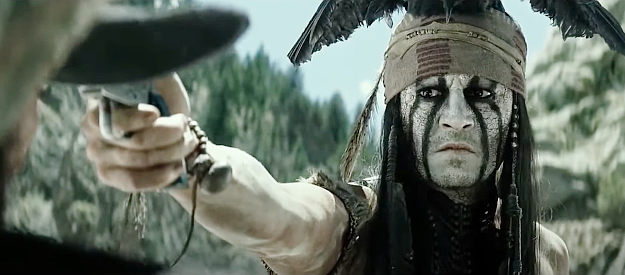 Johnny Depp as Tonto, ready to end Butch Cavendish's outlaw career in The Lone Ranger (2013)