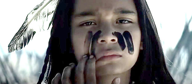 Joseph E. Foy as young Tonto, tormented by what happened to his village because of a secret he revealed in The Lone Ranger (2013)