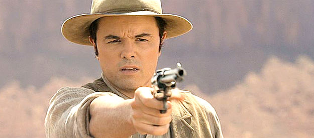 Seth MacFarlane as Albert, practicing his six-gun skills under the guidance of Anna in A Million Ways to Die in the West (2014)