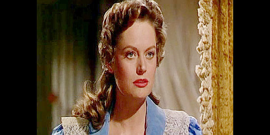 Alexis Smith as Elizabeth Trent, the pretty widow who convinces Pete Carver to invest in her newspaper in Cave of Outlaws (1951)