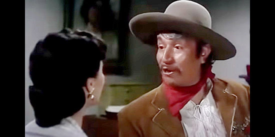 Alfonso Bedoya as Capt. Felipe Vargas, inadvertently revealing a secret to Carmelita in Border River (1954)