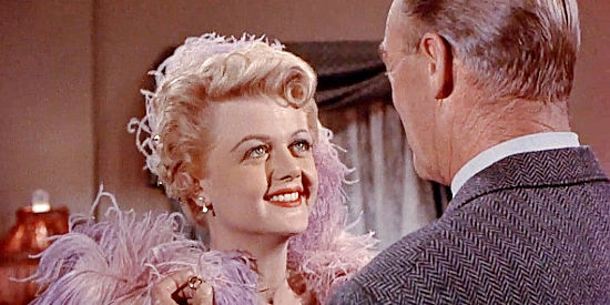 Angela Lansbury as Tally Dickenson, recalling the good times she enjoyed with Calem Ware (Randolph Scott) in A Lawless Street (1955)
