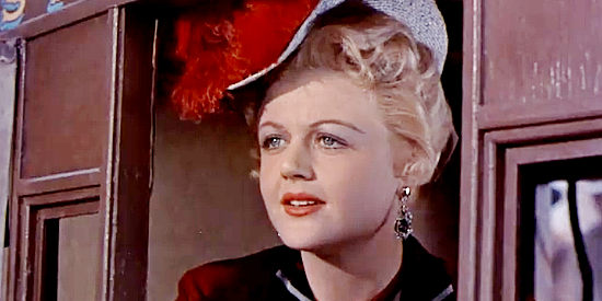 Angela Lansbury as Tally Dickenson, spotting a familar face when she arrives in Medicine Bend in A Lawless Street (1955)