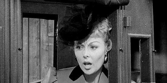 Angela Stevens as Laurie Webster, watching a gunfight play out in front of her in Blackjack Ketchum, Desperado (1956)