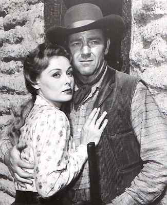 Angela Stevens as Mary Blake and Paul Langton as Rip Coker in Utah Blaine (1957)