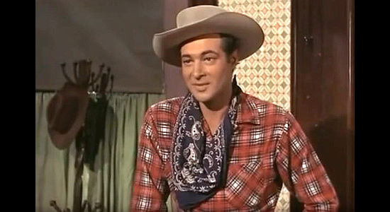 Anthony Dexter as Billy the Kid, arriving in Four Corners for a fresh start without six guns in The Parson and the Outlaw (1957)