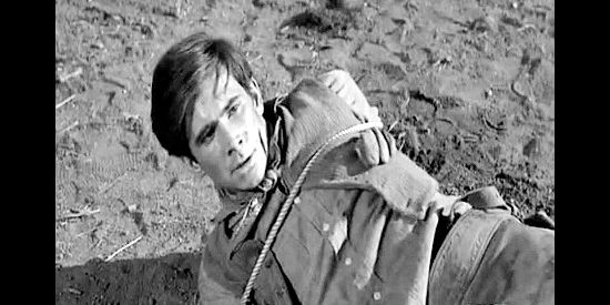 Anthony Perkins as Riley Wade, lassoed by a father trying to teach him a lesson in The Lonely Man (1957)