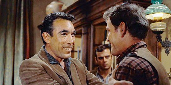 Anthony Quinn as Craig Belden, welcoming son Rick back to his ranch in Last Train from Gun Hill (1959)