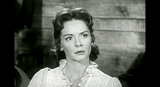 Arleen Whelan as Julie Johnson, threatened by Angus McKane and his men in Raiders of Old California (1957)