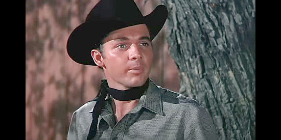 Audie Murphy as Bill Doolin, refusing to surrender though pinned in on both sides of town in The Cimarron Kid (1952)