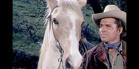 Audie Murphy as Jim Harvey with his borrowed horse Tumbleweed in Tumbleweed (1953)