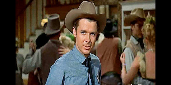 Audie Murphy as Tom Destry, summoned to bring law and order to a town called Restful in Destry (1954)