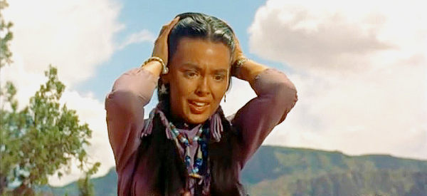 Barbara Rush as Oona, frantic as Taza and Naiche tussle in Taza, Son of Cochise (1954)