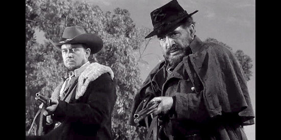 Ben Johnson as Frank Mason and J. Carroll Naish as Bedloe Mason, trying to force the release of Gray in Rebel in Town (1956)