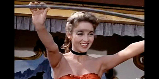 Beverly Garland as Mona Langley, preparing to do a sword trick with Serge Bolanos's traveling show in The Saga of Hemp Brown (1958)