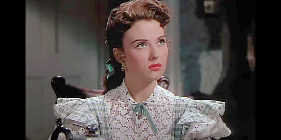 Beverly Tyler as Carrie Roberts, the rancher's daughter who falls for Bill Doolin in spite of his lawless ways in The Cimarron Kid (1952)