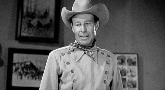Bill Elliott as Jim Kirk visits a rough-and-tumble saloon to find a trail crew in The Longhorn (1951)