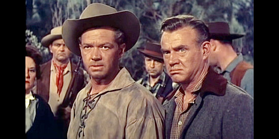 Bill Williams as wagon train boss Matt Delaney and Dabbs Greer as John Brewster, wondering about their new scout in Pawnee (1957)