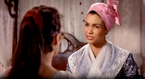 Carolle Drake as Michelle, the slave who runs Hamish's mansion in New Orleans in Band of Angels (1957)