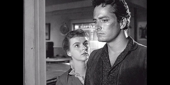 Carolyn Craig as Ginny Clay, trying to convince Brock Mitchell (John Derek) to forgoe vengeance for their sake in Fury at Showdown (1957)