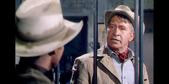 Chill Wills as Sheriff Murchoree, locking Jim Harvey behind bars for his safety in Tumbleweed (1963)