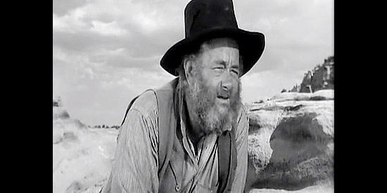 Chubby Johnson as Gil Craigie, the stagecoach driver who winds up on the mountain with Lafe Barstow and his men in Rocky Mountain (1950)