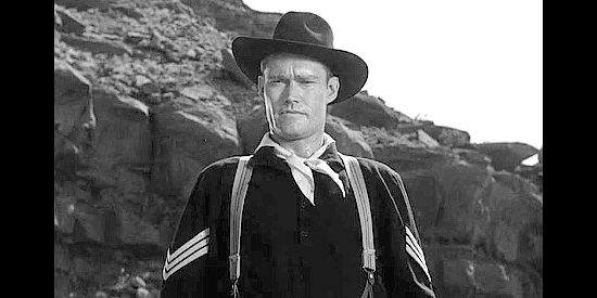 Chuck Connors as Sgt. Wade McCoy, risking court martial by questioning his commanding officer's decisions in Tomahawk Trail (1957)