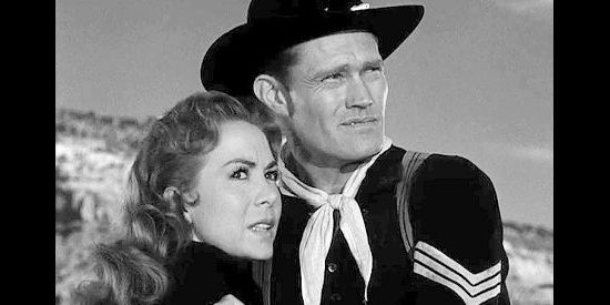 Chuck Connors as Sgt. Wade McCoy tries to comfort Ellen Carter as she frets about an Indian attack in Tomahawk Trail (1957)