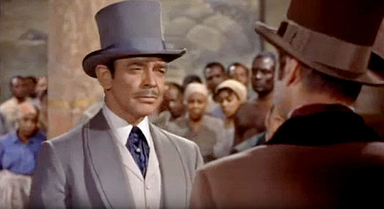 Clark Gable as Hamish Bond, showing up at auction to bid $5,000 for Amantha in Band of Angels (1957)