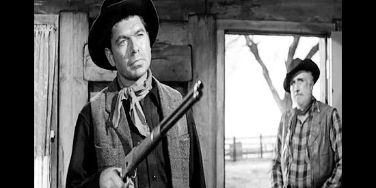 Claude Akins as Blackburn, a former outlaw partner demanding fresh horses from Jacob Wade in The Lonely Man (1957)