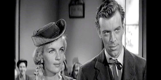 Corinne Calvet as Kathy Martin and Skip Homeier as her brand new husband Joe in Plunderers of Painted Flats (1959)