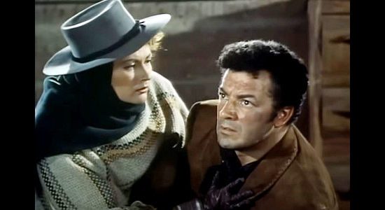 Cornel Wilde as Juan Obregon, getting a bit of welcome news from Tona (Yvonne De Carlo) in Passion (1954)