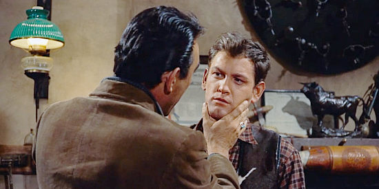 Craig Belden (Anthony Quinn) checking the new mark on son Rick's face (Earl Holliman) in Last Train from Gun Hill (1959)