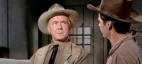 Dean Jagger as Sheriff Jade Murphy, trying to convince Alec Longmire (Rory Calhoun) to pin on a deputy's badge in Red Sundown (1956)