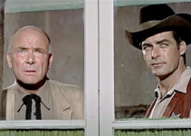 Dean Jagger as Sheriff Murphy and Rory Calhoun as Alec Longmire, watching for trouble in Red Sundown (1956)